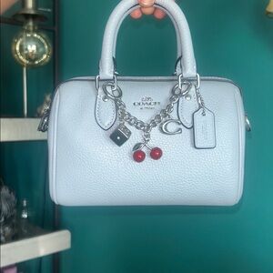 Coach mini Rowan with charm -ice blue w/silver hardware